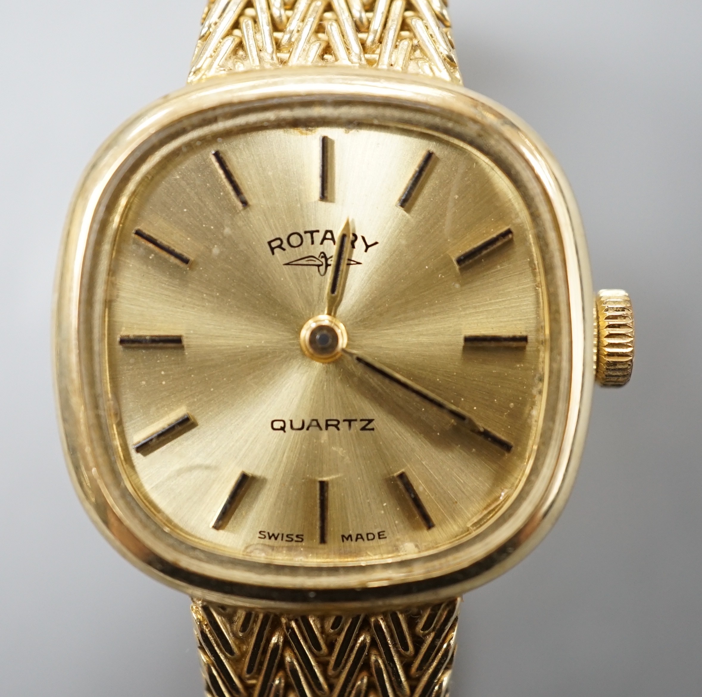 A lady's modern 9ct gold Rotary quartz wrist watch, on a 9ct gold bracelet, gross weight 30.3 grams.